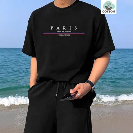 Man wearing a loose fit pure cotton t-shirt with a printed letter design on the front in apricot colour.