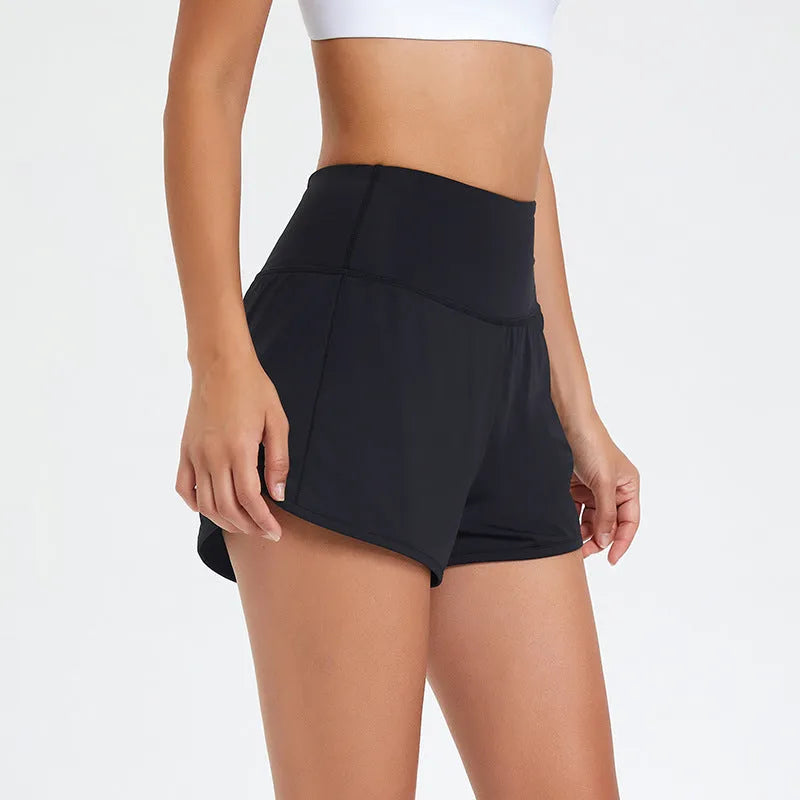 Women's high-waist quick-drying nylon fitness shorts in black, water blue, and white colours.