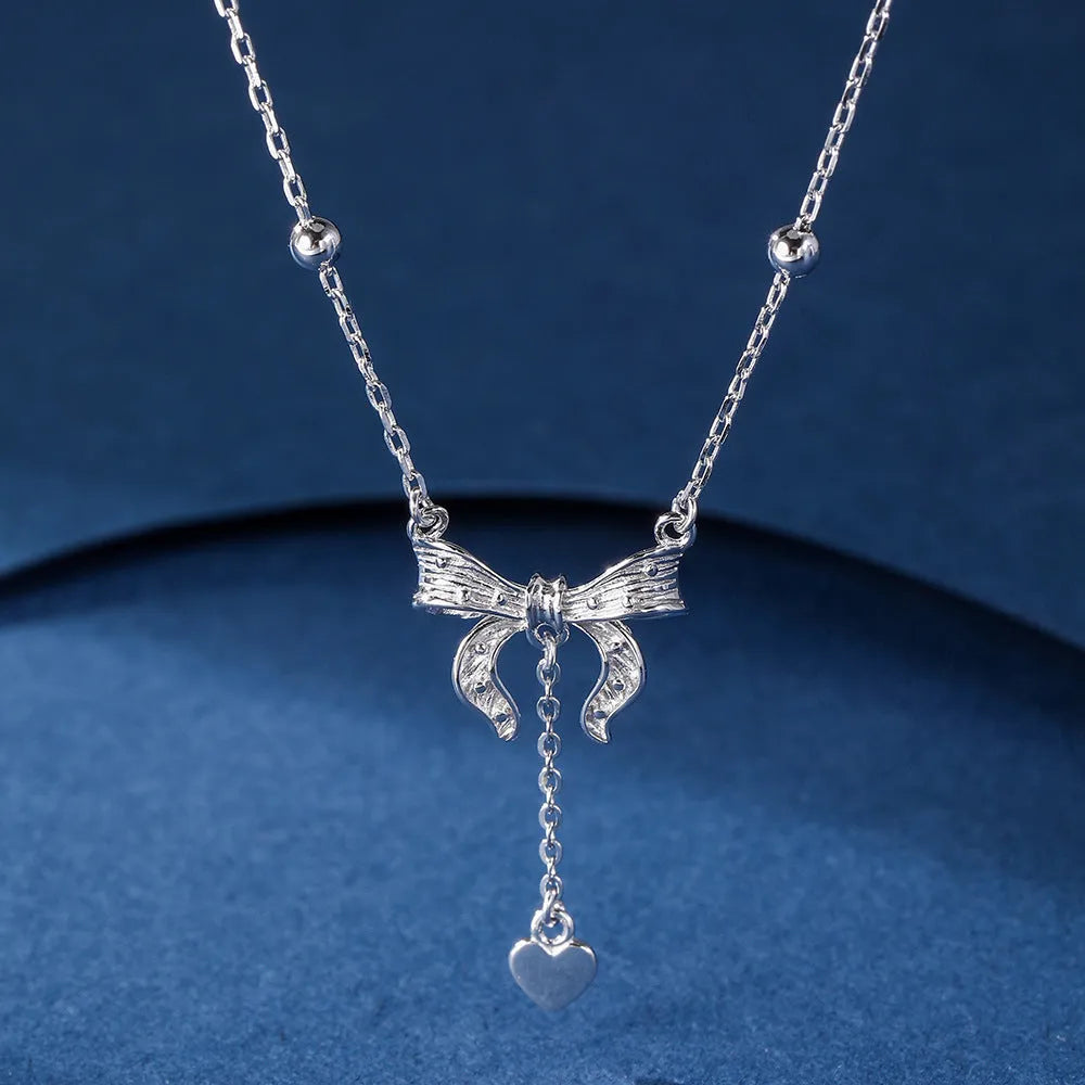 S925 pure silver butterfly and heart-shaped pendant on a silver O-ring clavicle chain.