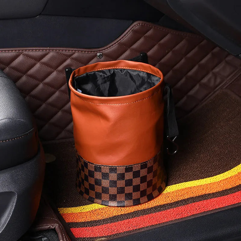 Leather retractable folding car trash can with handle shown in vehicle interior
