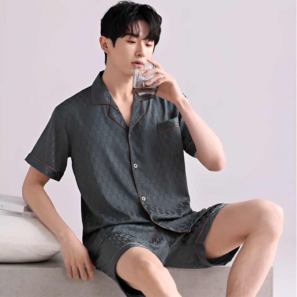 Man's lightweight ice silk pajama set in a blue houndstooth satin jacquard pattern, cardigan style with short pants.