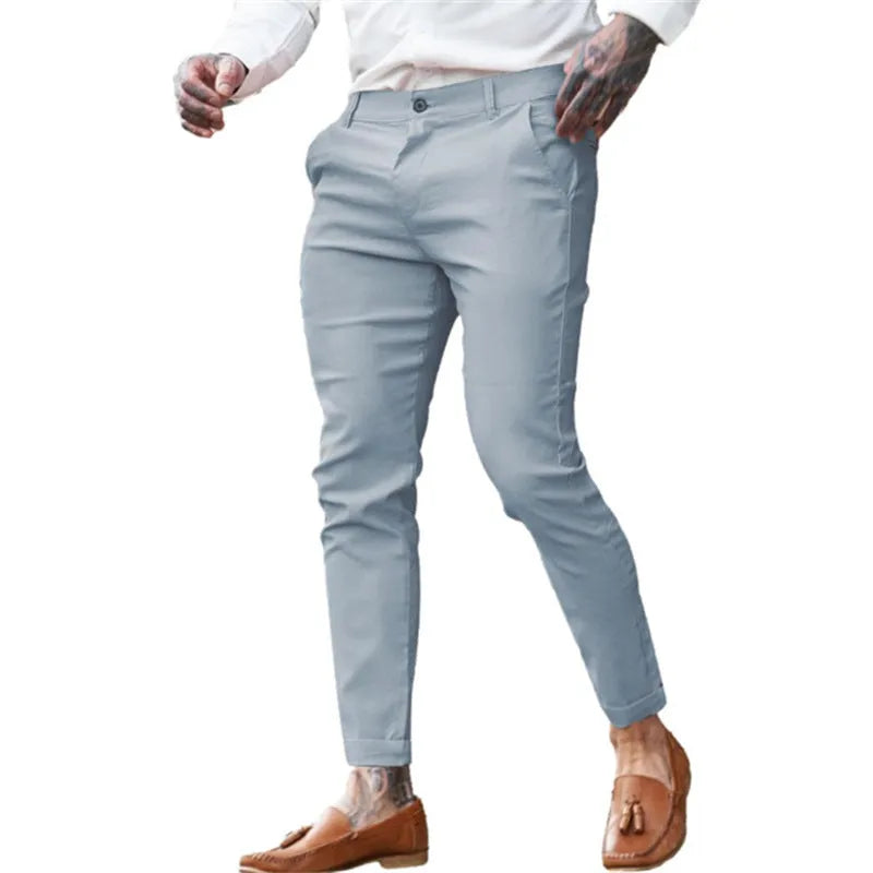 Men's slim-fit pencil trousers in stretch cotton twill fabric, shown in a dark blue colour.