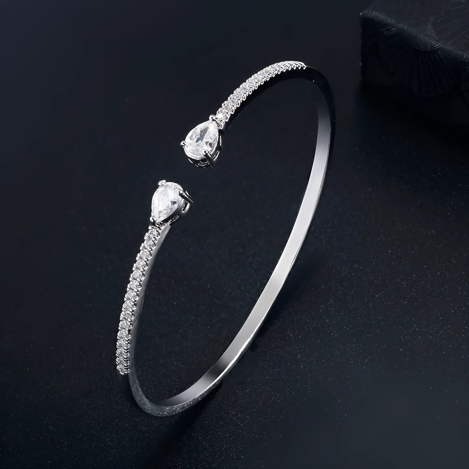 Copper bracelet with multi-zircon decorative inlay in simple style, shown in blue and white colour options