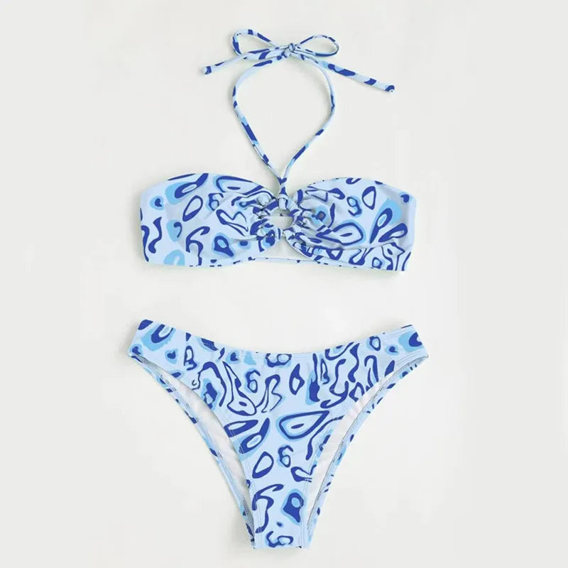 Green floral bandeau bikini swimsuit with split style bottom and backless design on mannequin