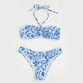 Green floral bandeau bikini swimsuit with split style bottom and backless design on mannequin