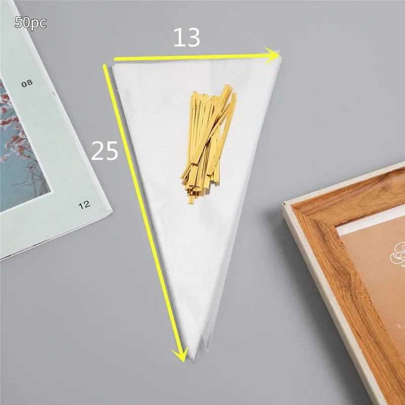 Clear triangle-shaped plastic packaging bags with a twisted wire tie closure on a white background.