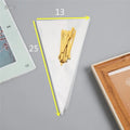 Clear triangle-shaped plastic packaging bags with a twisted wire tie closure on a white background.
