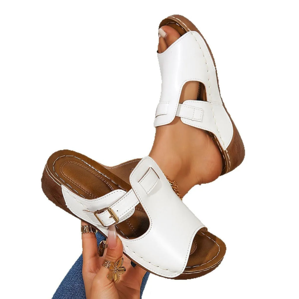 Women's light pink Roman sandal slippers with a fish mouth toe design, showing PU upper and EVA sole.