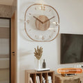 Square transparent wall clock with wooden frame showing visible quartz movement mechanism