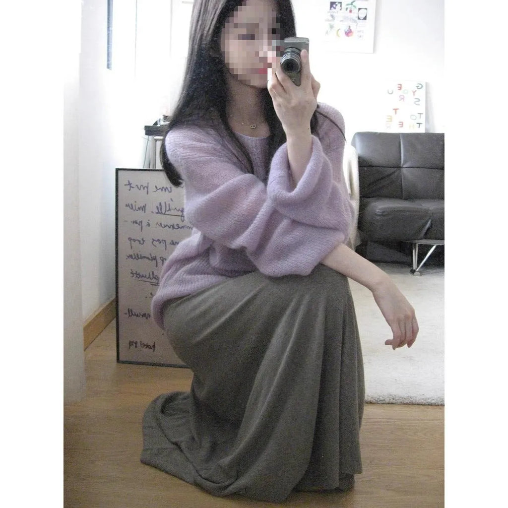 Purple women's blouse with hollow out pattern, princess sleeves, and shoulder strap detail on hanger