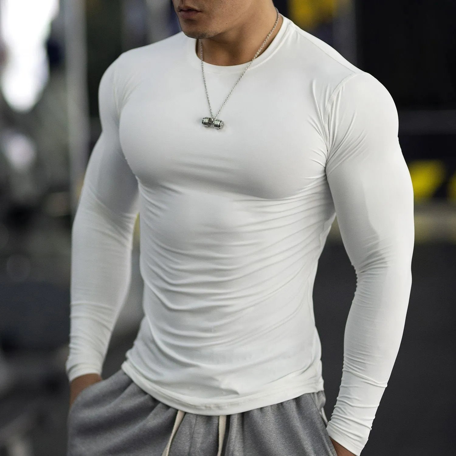 Men's black fitness tights with long sleeves for running and gym workouts