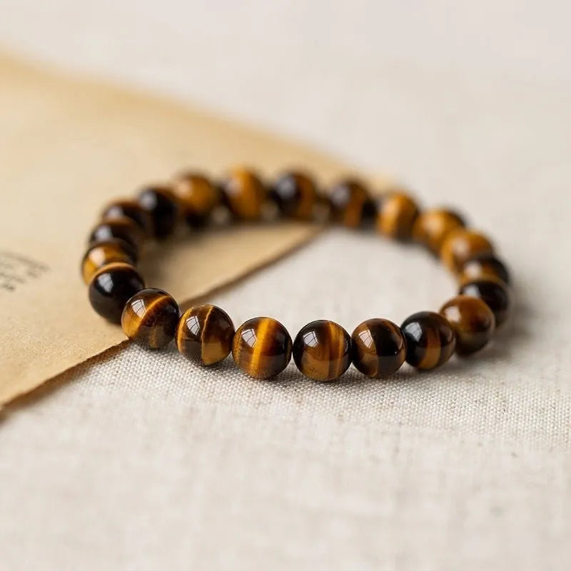 Simple Tigereye Dzi bead Buddha bracelet with single bead design on wrist