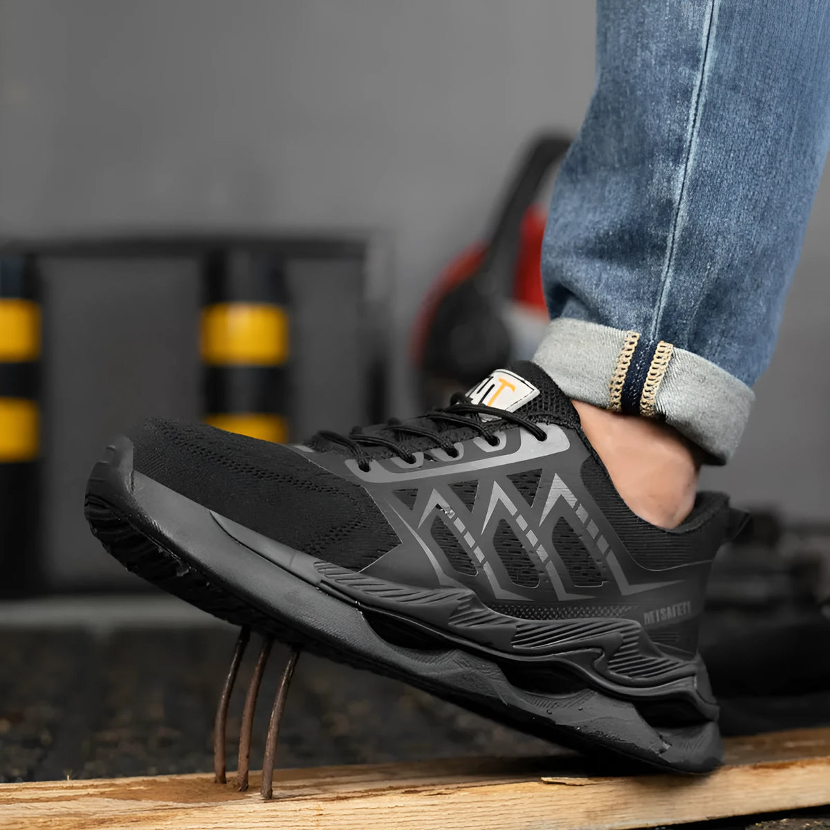 Black steel toe safety shoes with flat knitted uppers and lace-up front