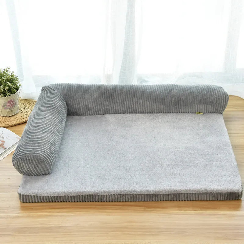 Corduroy pet dog bed with bolster sides on a non-slip base, shown in grey colour.