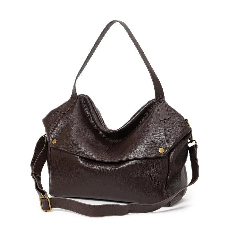 Brown genuine leather women's commuter shoulder bag with horizontal square shape showing zipper compartment