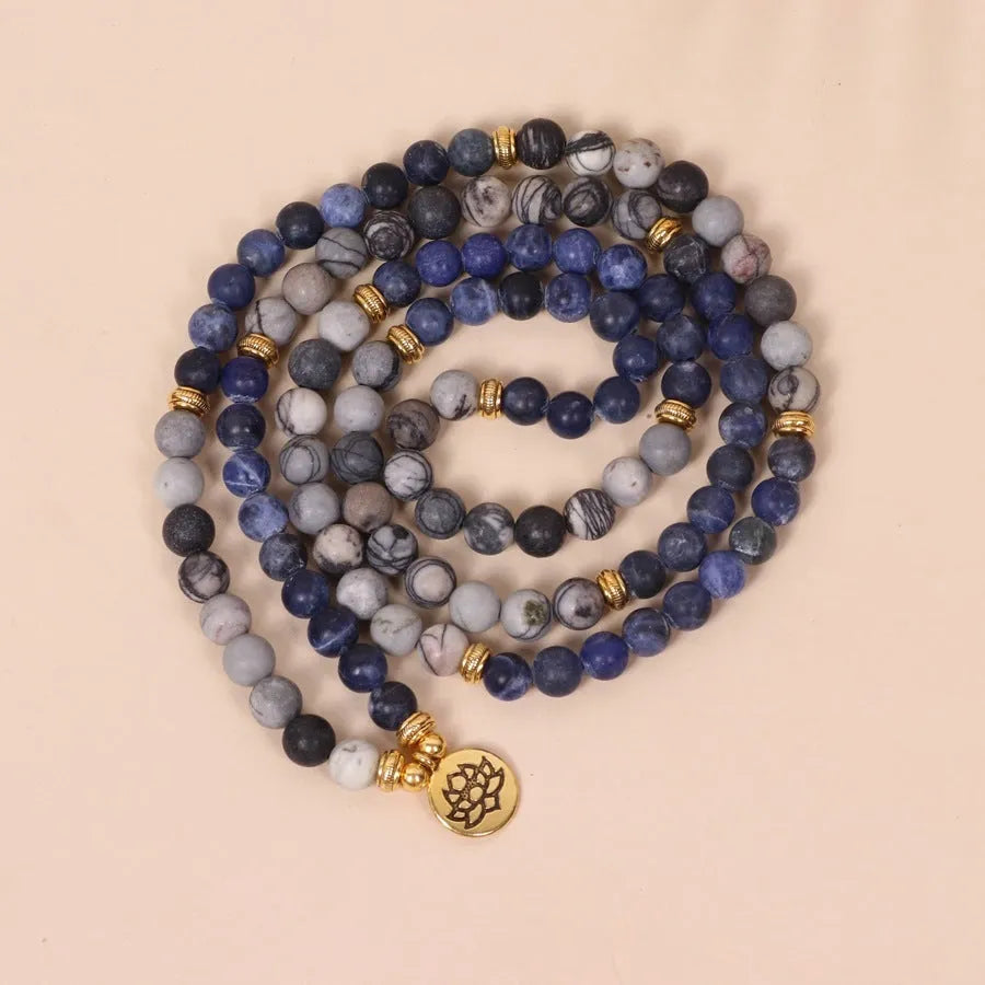 Blue patterned network stone beads on a multi-layer alloy bracelet in a natural style.
