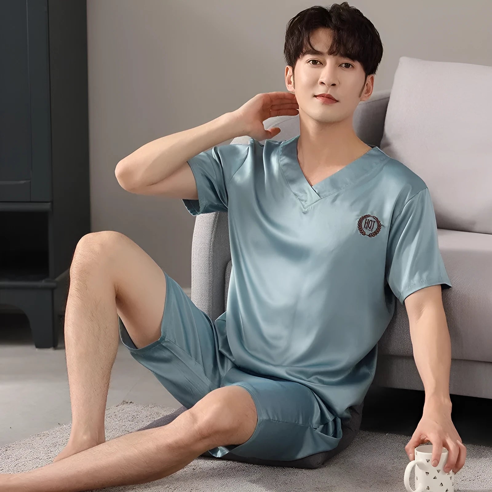 Men's ice silk pyjama set showing short-sleeved shirt and loose shorts in cooling fabric