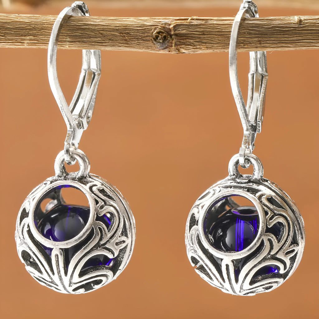 Silver geometric pendant earrings with vintage engraving and blue gemstone, shown from front view