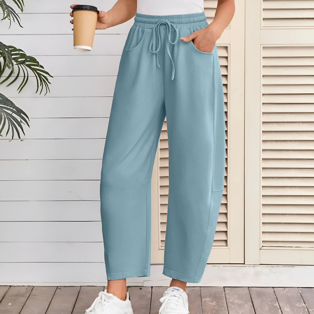 Women's loose cropped sweatpants with drawstring waist and side pockets in street fashion style