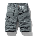 Men's army green cotton shorts with multiple pockets and a Korean-style fit on a neutral background.