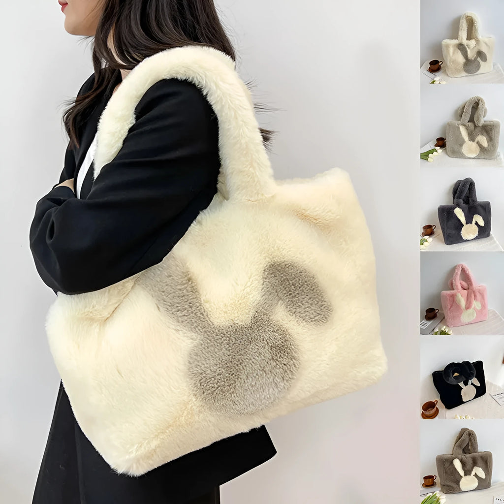 Soft plush tote bag with cartoon rabbit ears on the front in a solid colour.