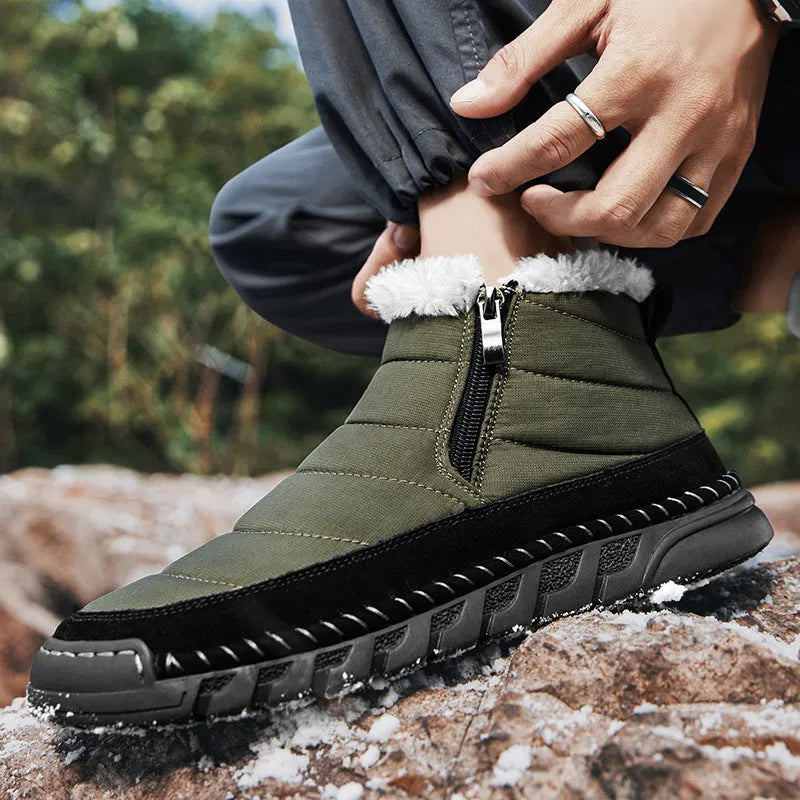 Men's green plus-size snow boot with round toe and flat heel on a rubber sole.
