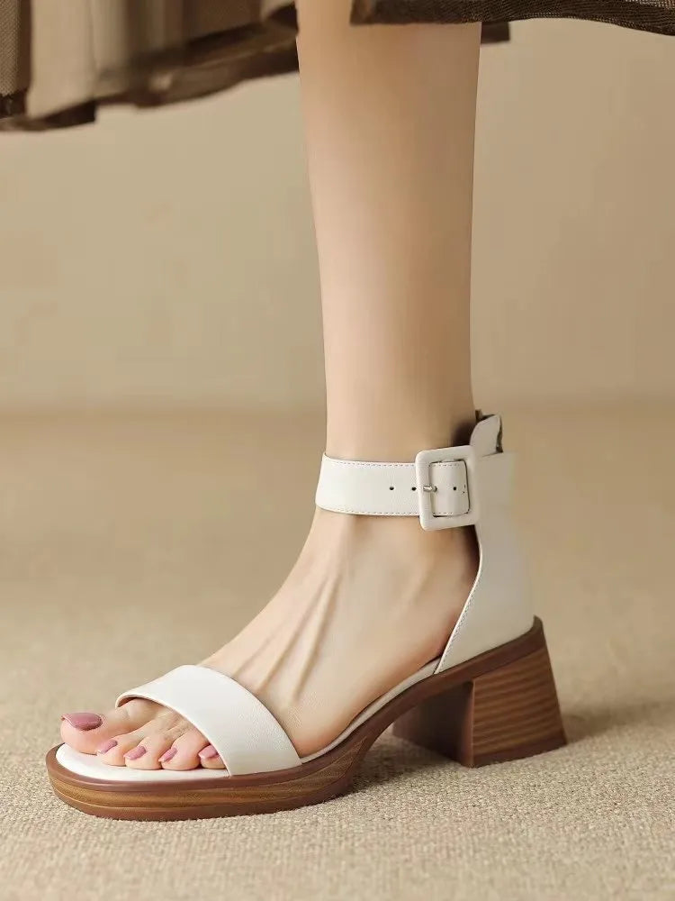 Women's white ankle-strap platform heels with round toe design