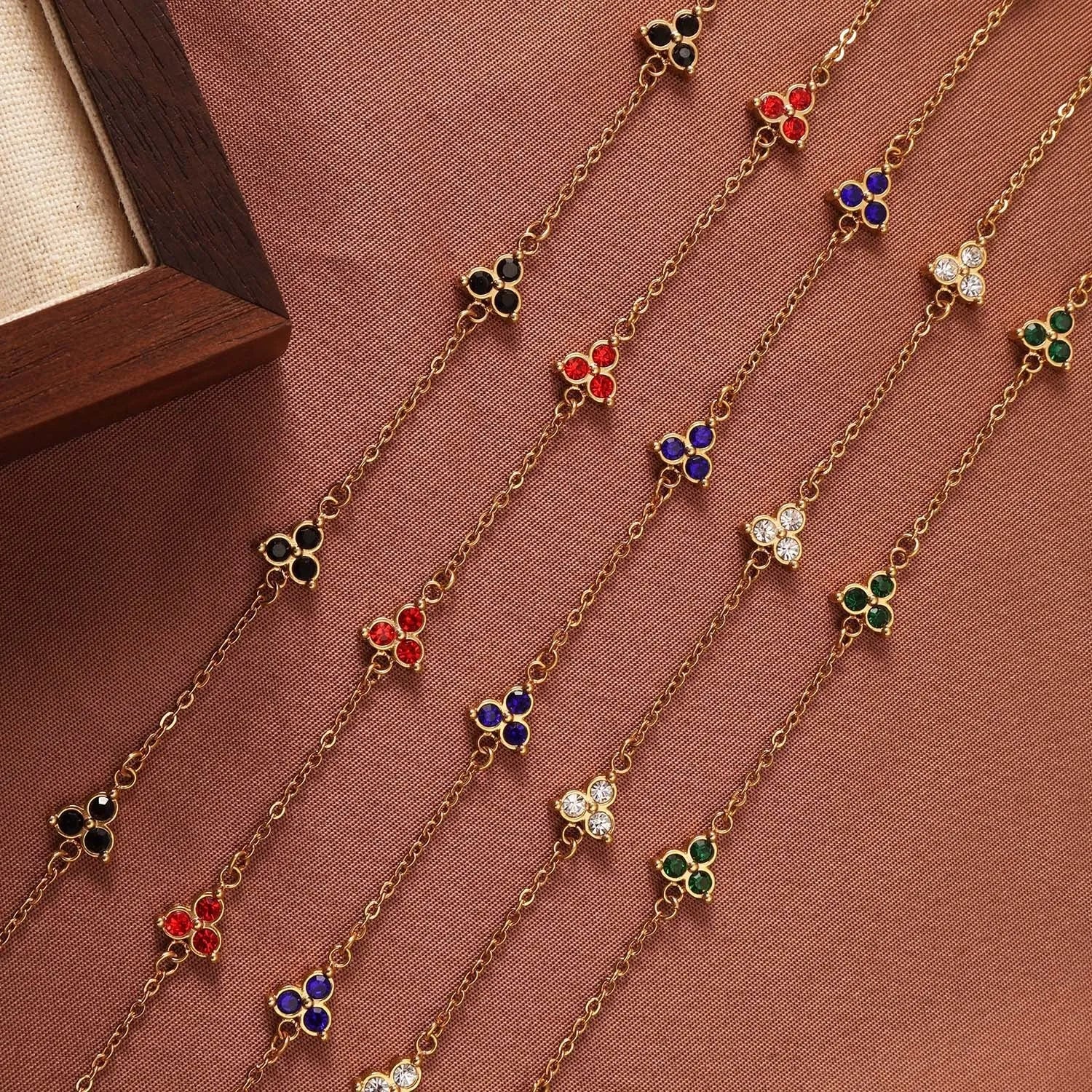 Women's stainless steel geometric triangle bracelet with three diamond stones and adjustable chain