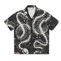 Short sleeve Cuban collar shirt with printed snake bone floral pattern in loose fit.