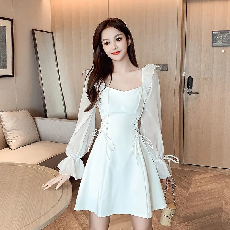 White chiffon patchwork waist-slimming dress with long sleeves and skirt on mannequin
