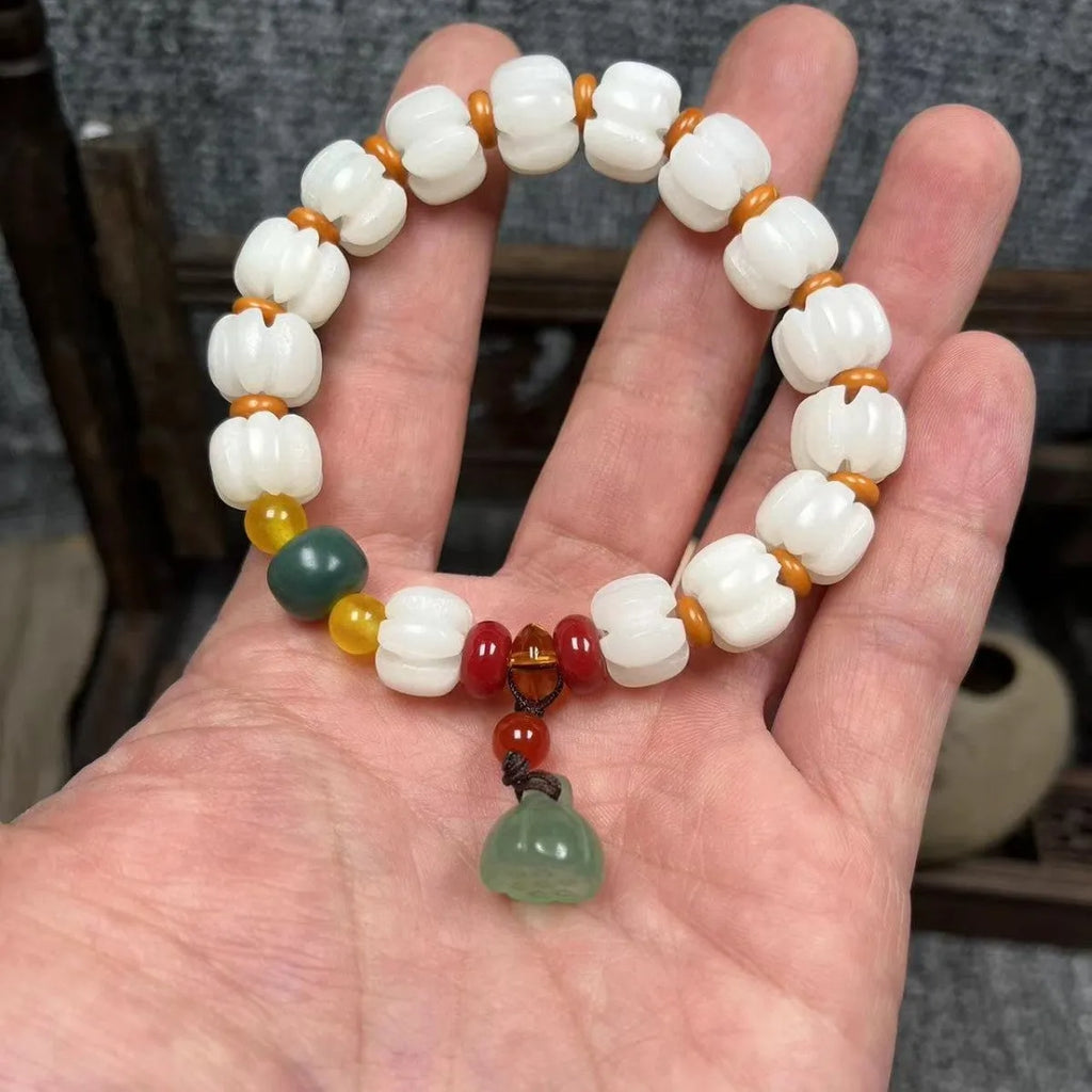 Carved Bodhi root bracelet with pumpkin lotus beads in various sizes and styles