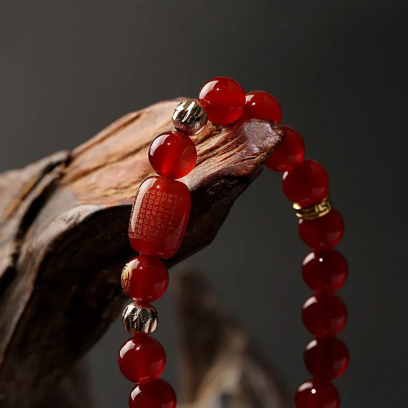 Red agate Guanyin bracelet with auspicious patterns in new Chinese style, showing Buddhist prayer beads