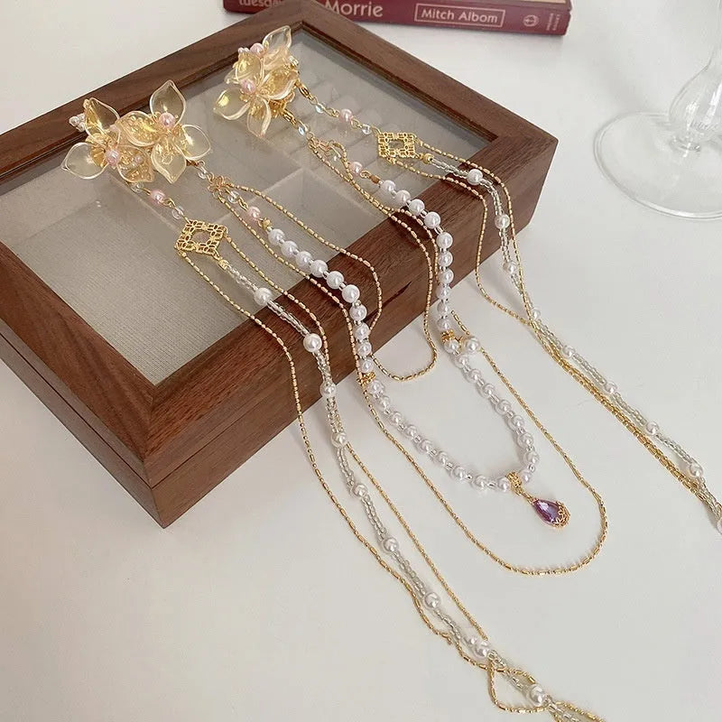 Women's pearl diamond flower hairpin with gold grip and long tassel decorative accessory