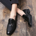 Men's black pointed slip on shoes with tassel detail on artificial PU upper