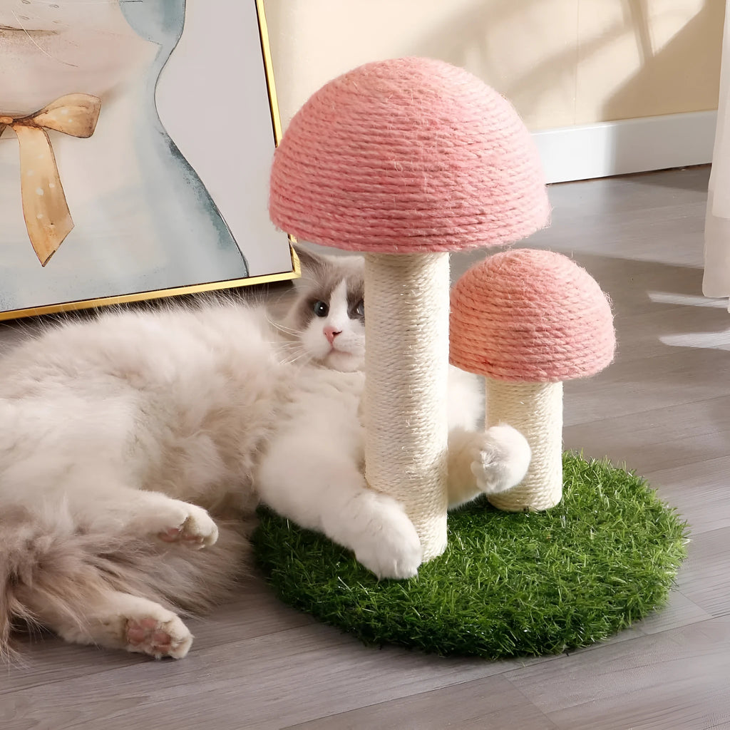 Pink mushroom-shaped cat scratching post with sisal-covered caps and pole for kittens.