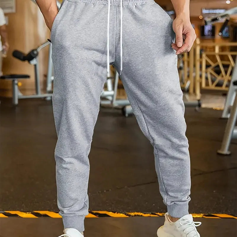 Men's linen leisure trousers with elastic drawstring waist in thin polyester fabric, loose fit design