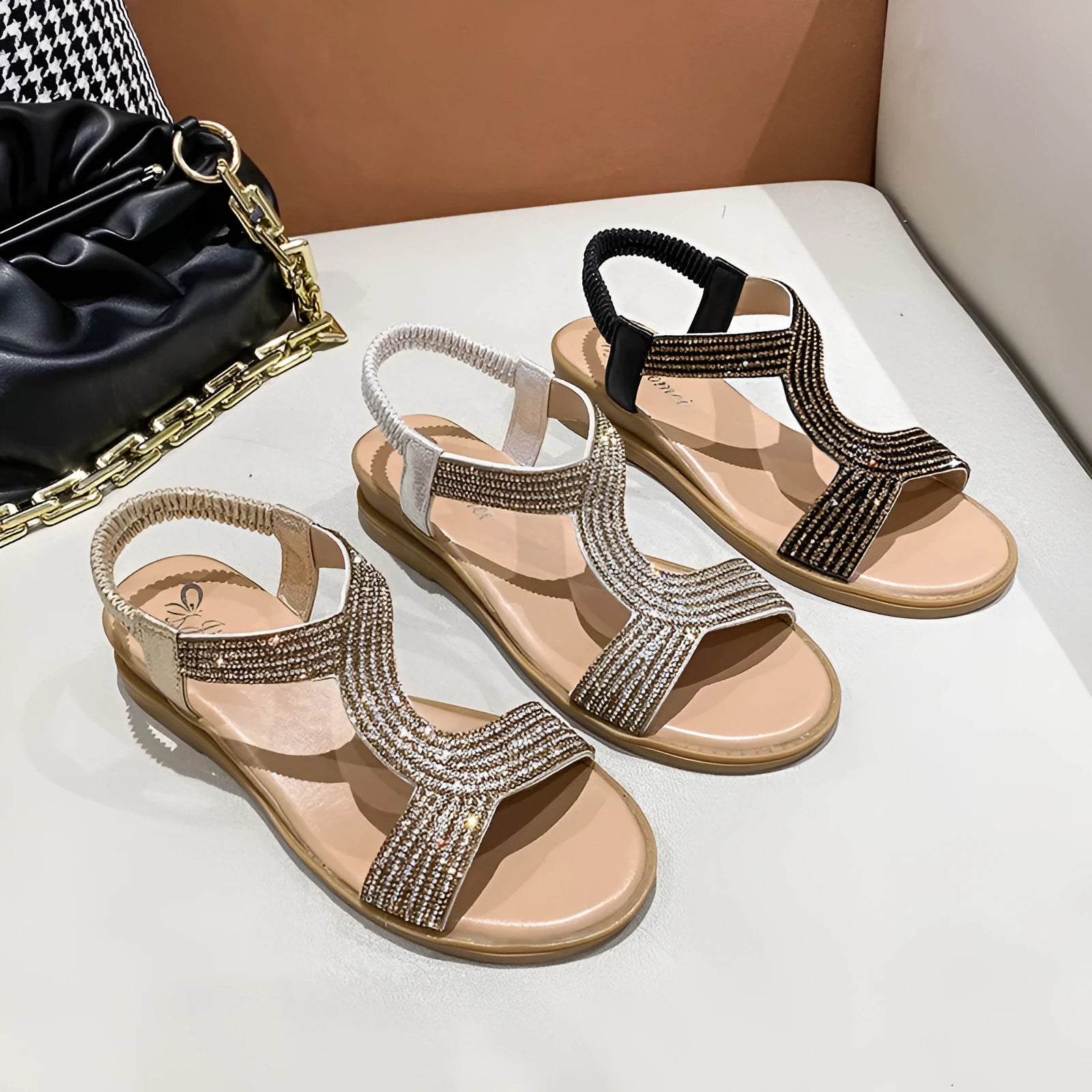 Women's gold PU leather beach sandals with rhinestone decoration on the strap.