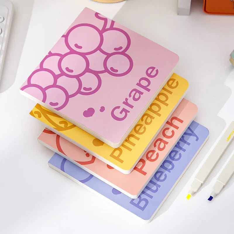 Square fruit-embossed notebook showing 14.5 cm dimensions and 80g thickened paper pages.