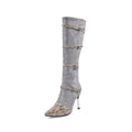 Grey and black women's knee-high boots with a thin high heel on a neutral background.
