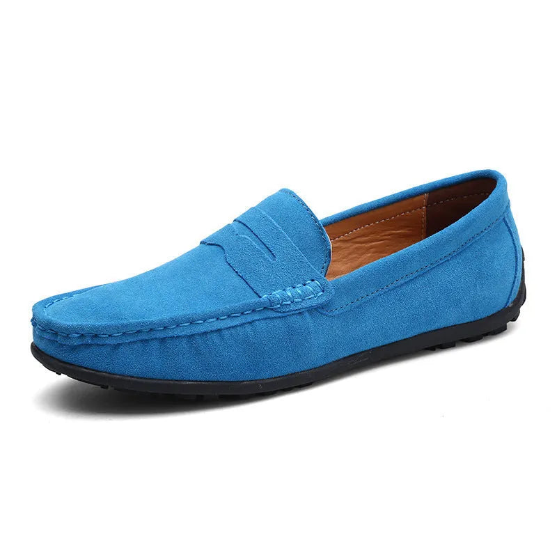 Men's brown suede casual loafers with a round toe, flat rubber sole, and visible stitching on a white background.