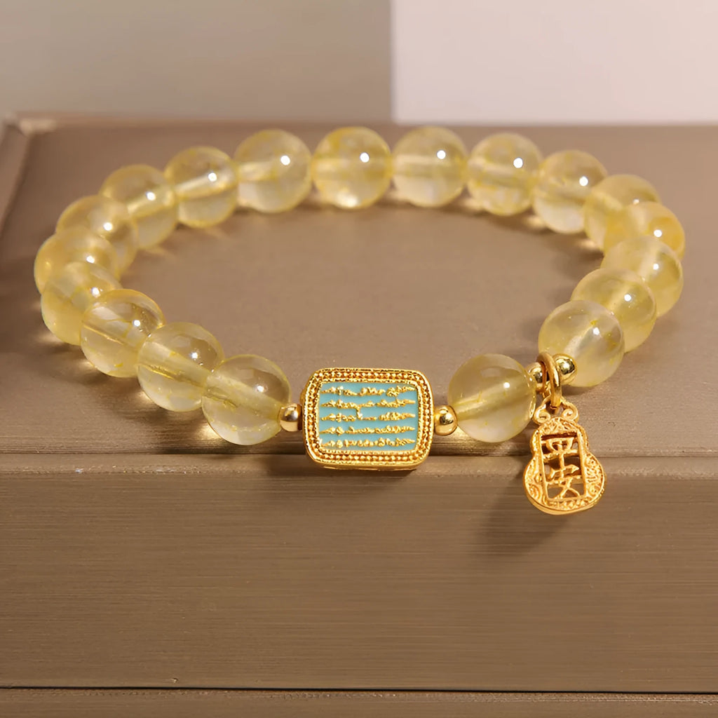 Citrine yellow crystal women's bracelet with sparkling rhinestone decorative elements.