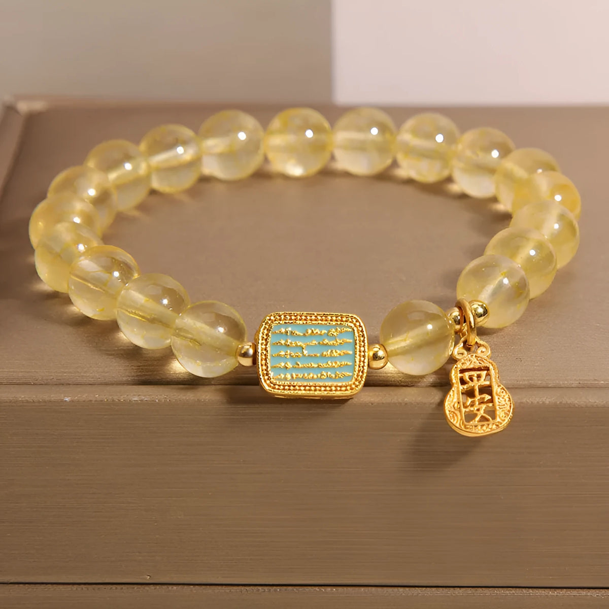 Citrine yellow crystal women's bracelet with sparkling rhinestone decorative elements.
