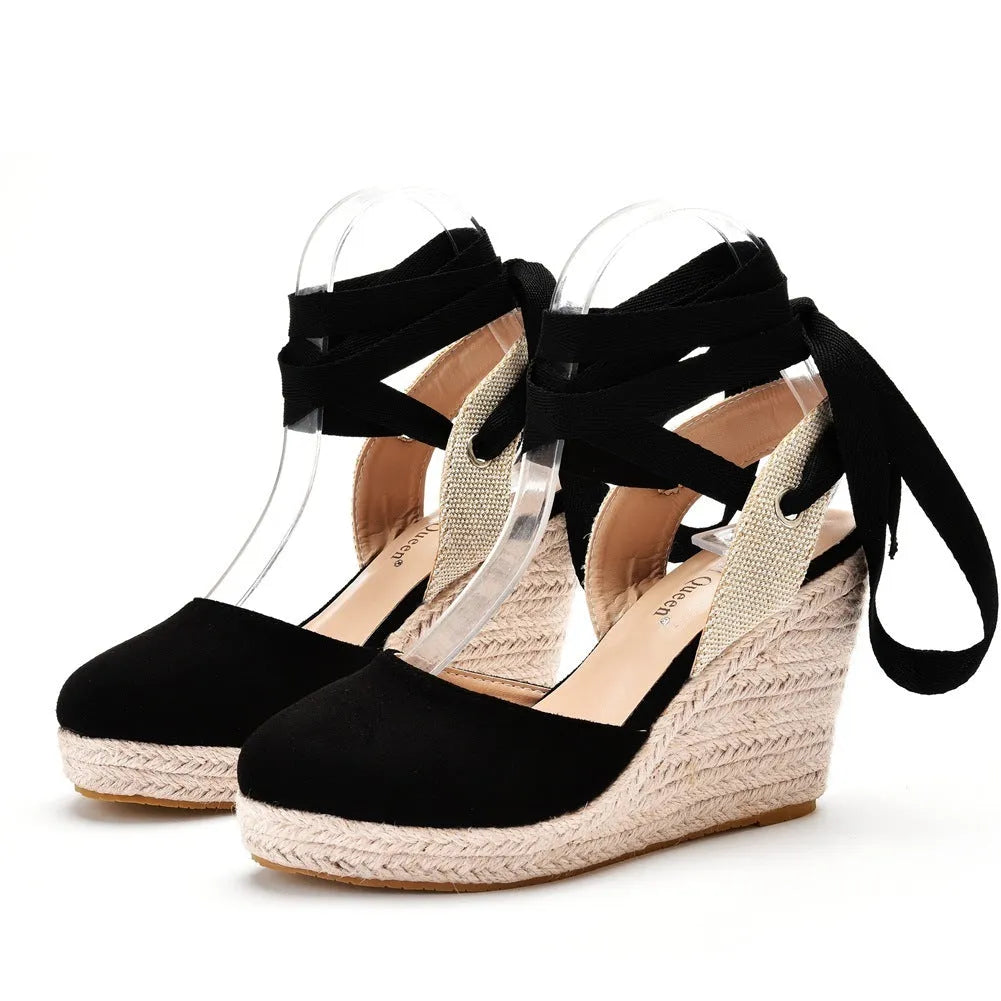 Women's apricot wedge sandals with buckle strap, beaded detail, and a round toe.