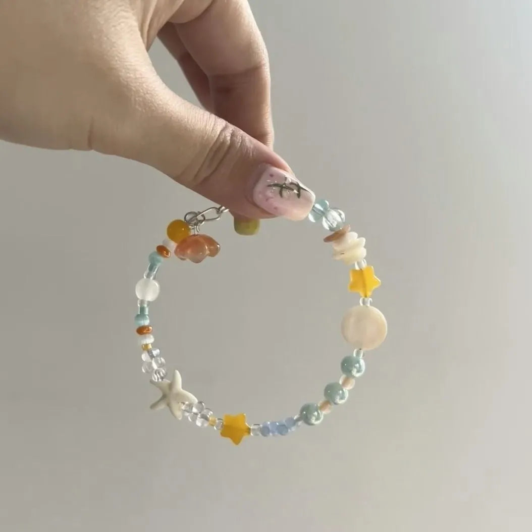 Orange sea coloured alloy bracelet with crystal beads and diamond pendant for women