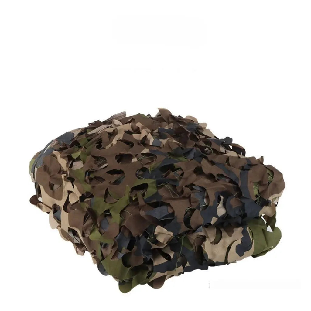 Green camouflage net set deployed as military camp cover with desert pattern visible