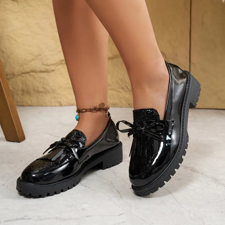 Women's brown and black bow detail loafers made from artificial PU, slip-on style.