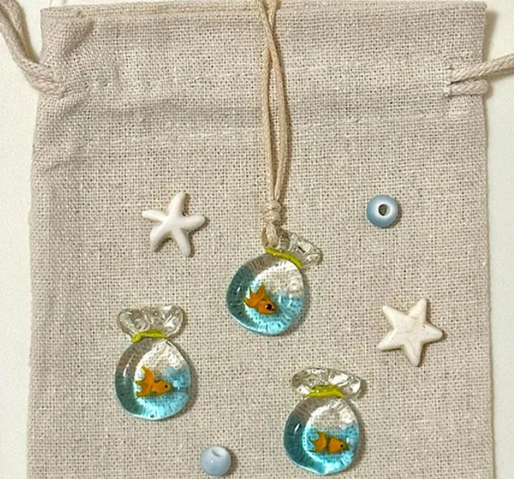 Women's necklace with a coloured glaze joker skirt pendant on a cotton and linen clavicle chain.