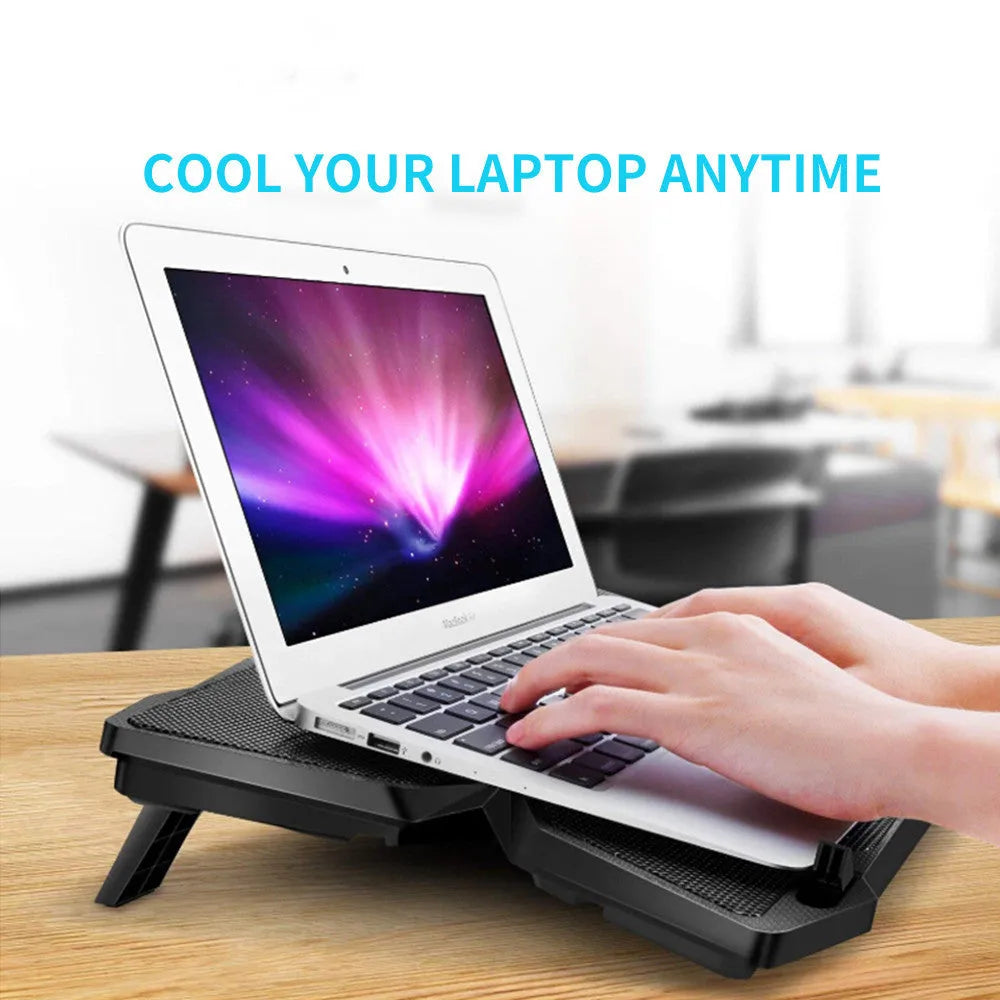 Blue laptop cooling base showing four illuminated LED fans and two USB ports on the front edge.
