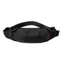 Men's black Oxford cloth crossbody waist pack showing interior organisation pockets