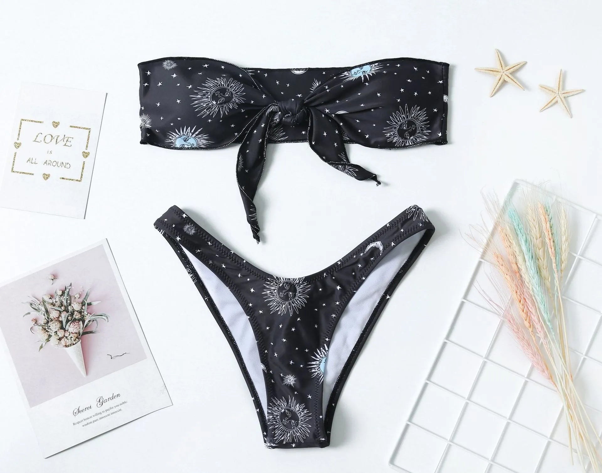 Black one-piece swimsuit with bikini print and backless design for women's swimming and fitness